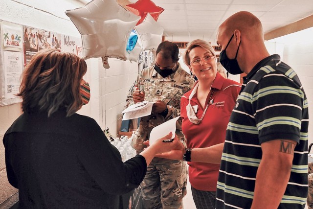 Sybell Hamilton, left, and Kerstin Ellis, center, with Drury University, talk with Sgt. 1st Class James Mars, Army National Guard proponency noncommissioned officer with the Maneuver Support Center of Excellence Chemical, Biological, Radiological...