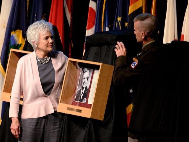 Mary Beth Brown, niece of retired Brig. Gen. Elizabeth Hoisington, and Maj. Gen. Donn Hill, deputy commanding general for education, Combined Arms Center, unveil Hoisington's Fort Leavenworth Hall of Fame portrait during the Hall of Fame induction...