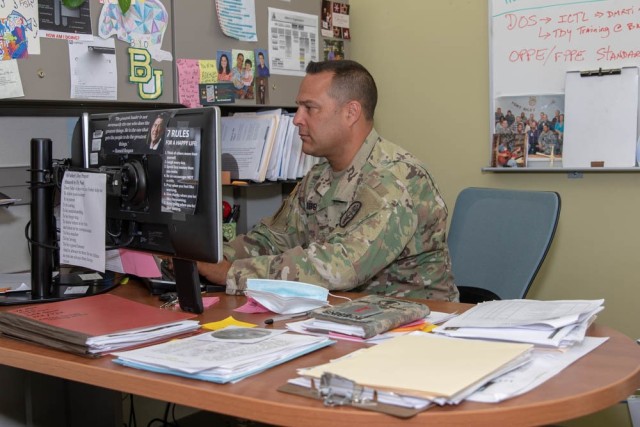 Martin Army Community Hospital Department of Rehabilitative Services Chief Maj. Travis Robbins pictured in his office. (U.S. Army photo courtesy of Ron Mooney)