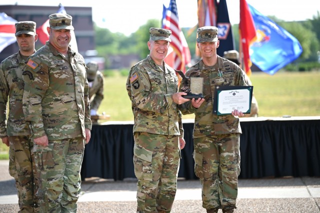 Staff Sgt. Cabot Cobb, a drill instructor assigned to the School of Music and the Combined Arms Support Command’s Drill Sergeant of the Year, is acknowledged by Maj. Gen. Rodney D. Fogg, CASCOM and Fort Lee commanding general, and Command Sgt....