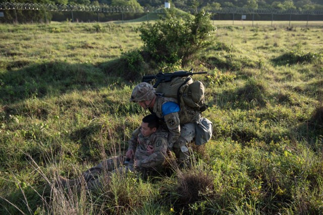 Wurzburg, Germany native, Spc. Steven Martinez, 1st Medical Brigade, drags a casualty at a medical lane during the ruck march event May 26.  During the 13th Expeditionary Sustainment Command’s 2021 Best Warrior Competition, Martinez won the...