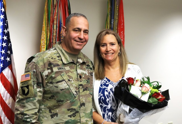 Mrs. Kristen Small stands with her husband Lt. Col. Michael Small after being named as U.S. Army Central Volunteer of the Year during a ceremony at Fort Knox, Kentucky May 26, 2021. Small was honored for her volunteer service with 1st Theater Sustainment Command. (U.S. Army photo by Spc. Owen Thez)