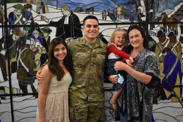 Pfc. Mason Calhoun, takes a photo with Family members after the Advanced Individual Training graduation ceremony for 56M, religious affairs specialist, of class 21-007 on May 13. His Family is the first to attend a USACHCS graduation in over a year. (Photo by Mel Slater)