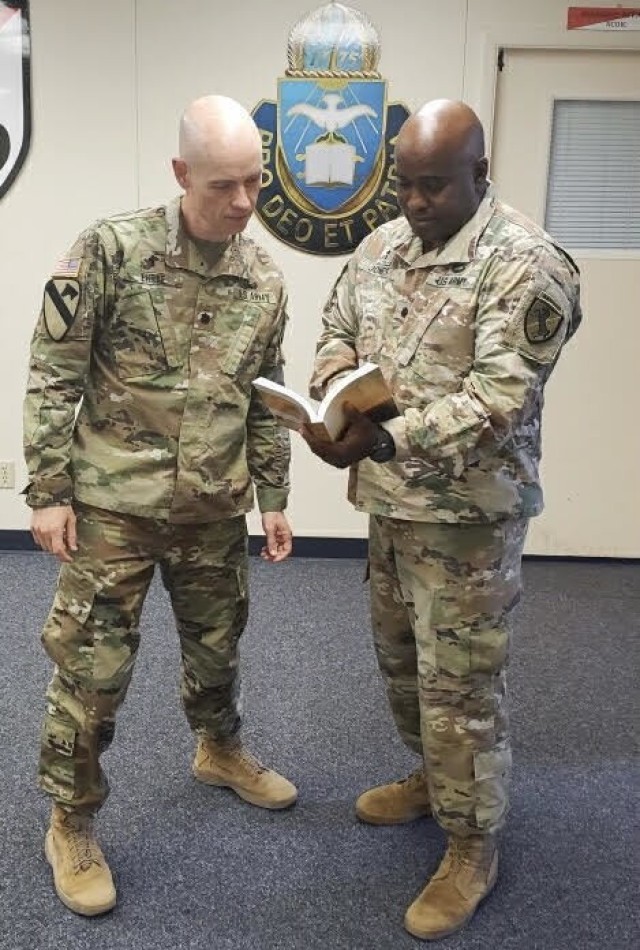 Chaplain (Lt. Col.) Donald Ehrke and Chaplain (Lt. Col.) Terrell Jones study material on counseling. Photo Credit: Casey Slusser, Fort Irwin Public Affairs