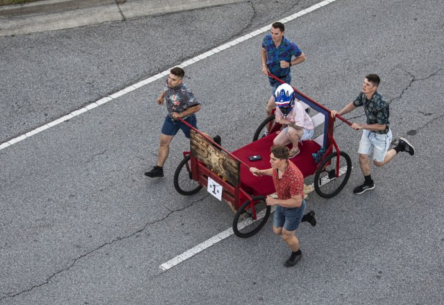 Dogface Soldiers assigned to 1st Battalion, 9th Field Artillery Regiment, 2nd Armored Brigade Combat Team, 3rd Infantry Division, push their battalion’s bed during the Bed Race of Marne Week 2021 on Fort Stewart, Georgia, May 17, 2021. The bed race kicks off this Marne Week, standing in as a fun alternative to the traditional division run. (U.S. Army photo by Staff Sgt. Brian K. Ragin Jr.)