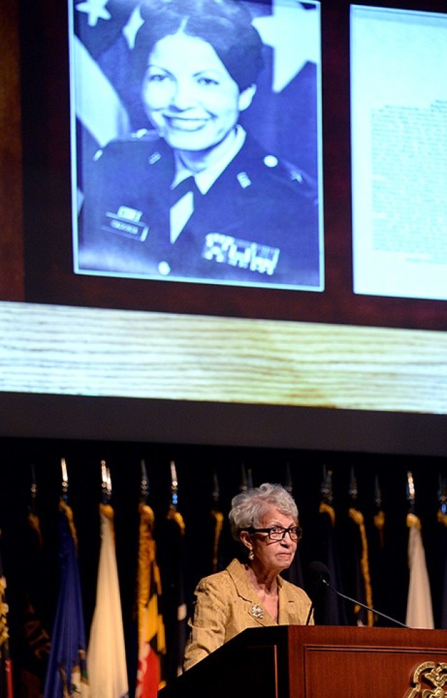 With her Fort Leavenworth Hall of Fame portrait projected overhead, retired Brig. Gen. Sherian Cadoria delivers remarks during her Hall of Fame induction ceremony May 20 at the Lewis and Clark Center. Gen. Leonard Gerow, commandant of the Command...