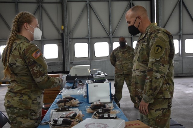 WIESBADEN, Germany – Pfc. Skyler Nisbet explains to Brig. Gen. Jed Schaertl how the blood products are packaged and shipped to Landstuhl Regional Medical Center after a blood drive.