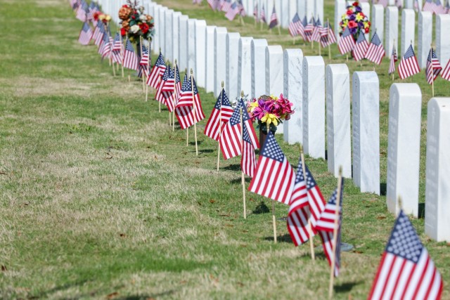FORT BENNING, Ga. – Maj. Gen. Patrick J. Donahoe commanding general, U.S. Army Maneuver Center of Excellence and Command Sgt. Maj. Derrick C. Garner command sergeant major, U.S. Army Maneuver Center of Excellence, pay tribute to those who paid the ultimate sacrifice during the U.S. Army Maneuver Center of Excellence Memorial day ceremony May 27, 2021 at the Fort Benning Cemetery. (U.S. Army photos by Markeith Horace, Fort Benning Maneuver Center of Excellence photographer)