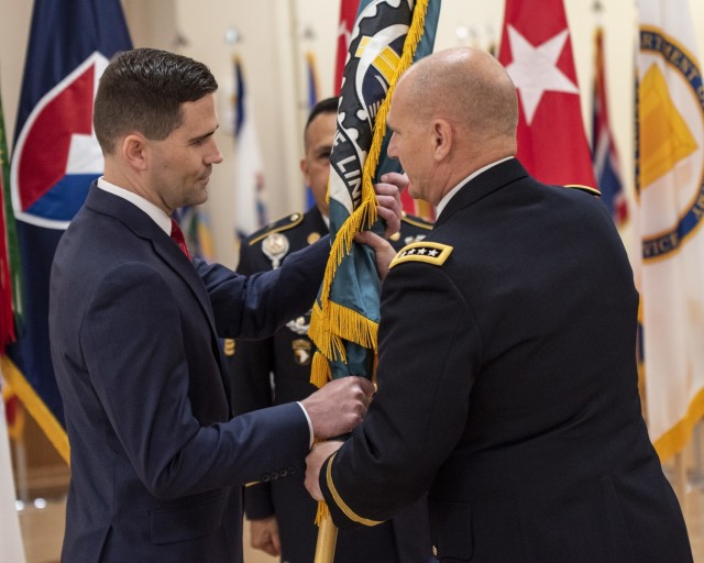 Matthew Sannito, ASC deputy to the commanding general, receives the ASC flag from Gen. Ed Daly, commanding general of the U.S. Army Materiel Command, during a relinquishment of command and retirement ceremony May 27. Sannito will serve as...