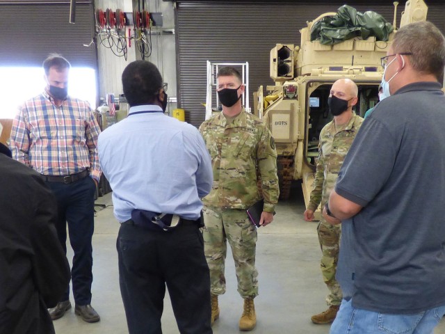 Maj. Gen. Patrick Donahoe (center background), Commanding General U.S. Army Maneuver Center of Excellence, and Col. Bryan Fowler (right background), Deputy Chief of Staff-Sustainment for MCoE, receives a briefing from the U.S. Army Tank-automotive...