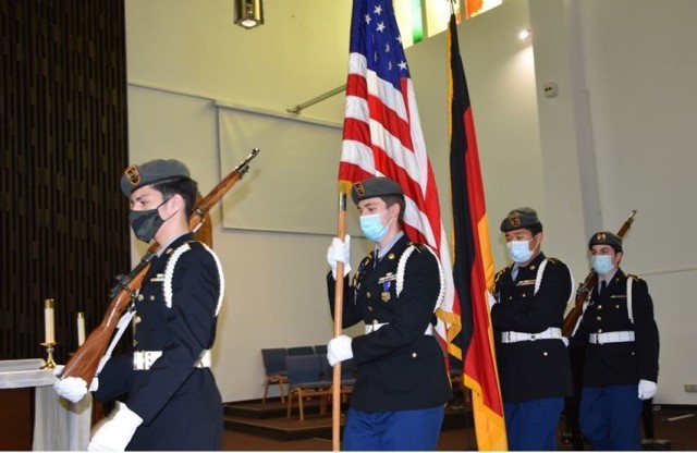 The Wiesbaden High School Junior Reserve Officers Training Corps Color Guard posts the colors at the Wiesbaden School Complex Memorial Day Ceremony May 26 on Hainerberg Kaserne.