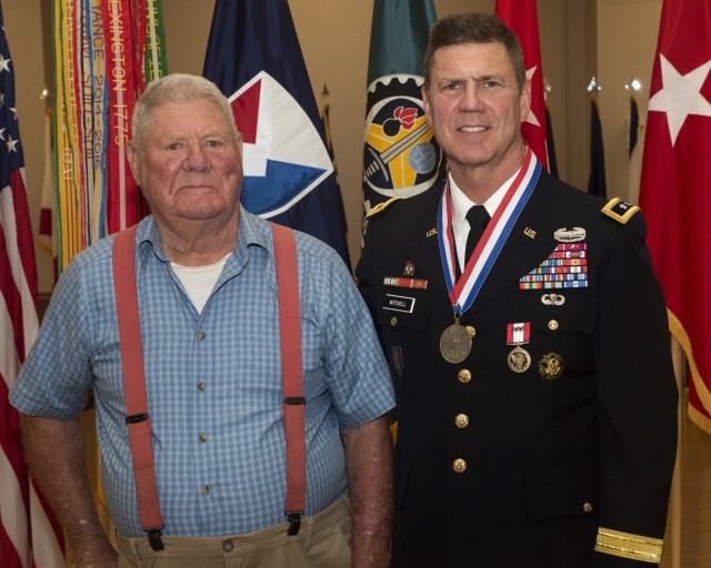 Maj. Gen. Daniel Mitchell stands with his father, Dr. Marvin Mitchell – a Korean War veteran and retired veterinarian – during a relinquishment of command and retirement ceremony May 27. (Photo by Linda Lambiotte, ASC Public Affairs)