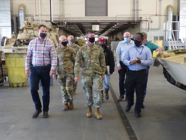 Maj. Gen. Patrick Donahoe (center), Commanding General U.S. Army Maneuver Center of Excellence, receives a briefing Heavy Track unscheduled maintenance operations from the U.S. Army Tank-automotive and Armaments Command’s Fleet Maintenance Expansion team at Fort Benning, Georgia on May 6. 
