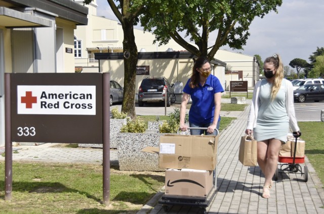 VICENZA, Italy - Michelle Sterkowicz, U.S. Army Garrison Italy Art Center program manager, (left) and Aurora Venden, American Red Cross Interim Regional program manager deliver ‘Resiliency through Art’ individual kits to several locations on...