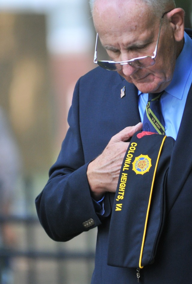 Jerry Chenault, 1st Vice Commander, American Legion Post 284, bows his head in prayer during the Butterfly Release event invocation May 26 at the Army Community Service Memorial Garden.