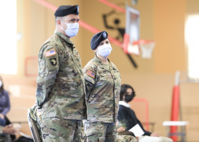 (From left) U.S. Army Lt. Cols. Mark Jones and Elizabeth Gum, listen as remarks are made about U.S. Army Health Cllinic Baumholder Army Health Clinic (BAHC), during a change of command ceremony where Gum relinquished command to Jones at Baumholder, May 26. U.S. Army Health Clinic Baumholder provides ambulatory care for Soldiers, their families, and others, and offers acute and chronic care of pediatric and adult patients, physical examinations, health-related career screening and immunizations, non-operative gynecological diagnosis and treatment, minor surgical procedures and surgical follow-up and newborn care. Baumholder Army Health Clinic also provides specialty care services to include behavioral medicine, pharmacy, optometry, radiology and physical therapy.