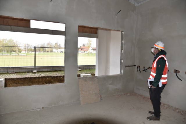 U.S. Army Corps of Engineers, Europe District Project Engineer Johann Buchfelder checks out ongoing construction of a new field house at Vilseck High School at Rose Barracks in U.S. Army Garrison Bavaria May 6, 2021. The new field house, adjacent to the school’s athletics field, will not only serve as an area to store athletics equipment but is being designed as a focal point for social activities and events. The project is part of the Army’s push for new and improved housing and other facilities to improve quality of life for Soldiers and their families stationed at Rose Barracks.