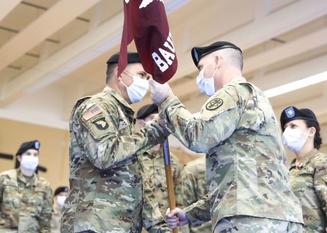U.S. Army Col. Andrew Landers (right), commander, Landstuhl Regional Medical Center, passes the U.S. Army Health Clinic Baumholder (BAHC) unit colors to U.S. Army Lt. Col. Mark Jones, incoming commander, BAHC, during a change of command ceremony where U.S. Army Lt. Col. Elizabeth Gum relinquished command of U.S. Army Health Clinic Baumholder (BAHC) to Jones at Baumholder, May 26. U.S. Army Health Clinic Baumholder provides ambulatory care for Soldiers, their families, and others, and offers acute and chronic care of pediatric and adult patients, physical examinations, health-related career screening and immunizations, non-operative gynecological diagnosis and treatment, minor surgical procedures and surgical follow-up and newborn care. Baumholder Army Health Clinic also provides specialty care services to include behavioral medicine, pharmacy, optometry, radiology and physical therapy.