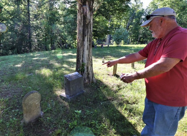 John Wise points out his great-grandfather’s headstone. Thomas Greenberry Wise was born in 1822 and died in 1896.