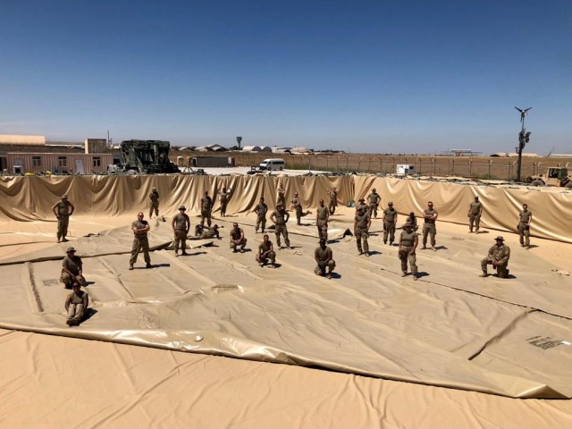Forward Logistics Element Soldiers replace a 210K gallon fuel bag at the Army’s largest operational Fuel System Supply Point (FSSP), at the Erbil Air Base, in Erbil, Iraq, on April 23, 2021.