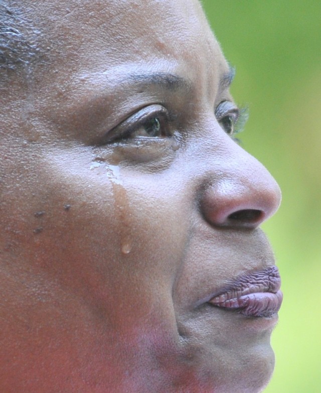 Stephanie Parker, ACS director, recalls the life and service of her father, a Soldier who died during the Vietnam War, during the annual Butterfly Release event May 26 at the Army Community Service Memorial Garden.