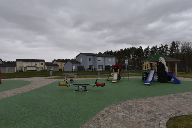 A recently completed playground and community gathering space can be seen here May 6, 2021 in the Kittenberg Housing Area on Rose Barracks in Vilseck, Germany, which is part of U.S. Army Garrison Bavaria. The U.S. Army Corps of Engineers delivered 20 new family homes and associated infrastructure in 2016, visible in the background, for Soldiers and their families. In 2021, the U.S. Army Corps of Engineers is delivering an additional 29 family homes and associated infrastructure, including the playground and gathering area that sit between the two new areas of housing within the larger Kittenberg Housing Area. The playground, gathering area and homes are part of a larger, long-term collaboration between the U.S. Army Corps of Engineers and the garrison to provide new and renovated family housing and other quality of life projects for Soldiers and their families at Rose Barracks.