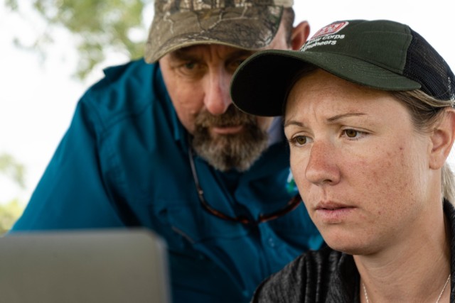 Jessica Fair, U.S. Army Corps of Engineers, biologist and Keith Mangus, Applied Aquatics, project manager view on a laptop how the Spray Tracker Platform developed by FWC’s Andrew Dew detects and collects the spray path of the licensed...