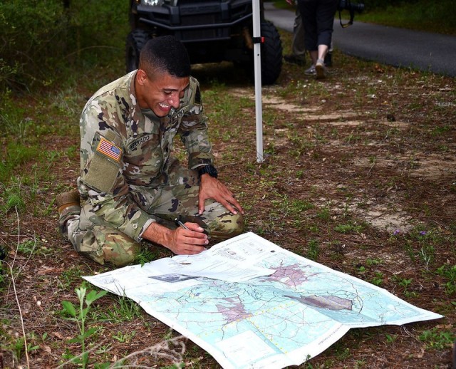 Spc. Christian Kerkado-Colon, a military policeman at Corpus Christi Army Depot, Texas, looks at a map May 11 during one of the 2021 U.S. Army Aviation Center of Excellence Best Warrior Competition at Fort Rucker, Ala. Kerkado was ultimately named...