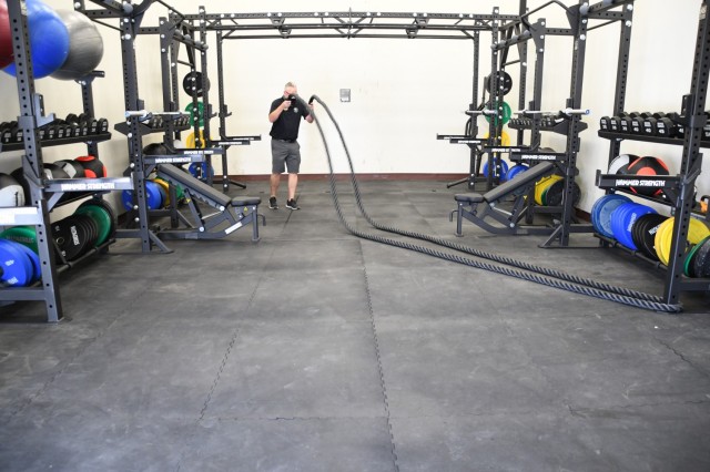 The room features, rubber octagon dumbbells, medicine balls, kettle bells, a two-inch twisted battle rope and plyo boxes.