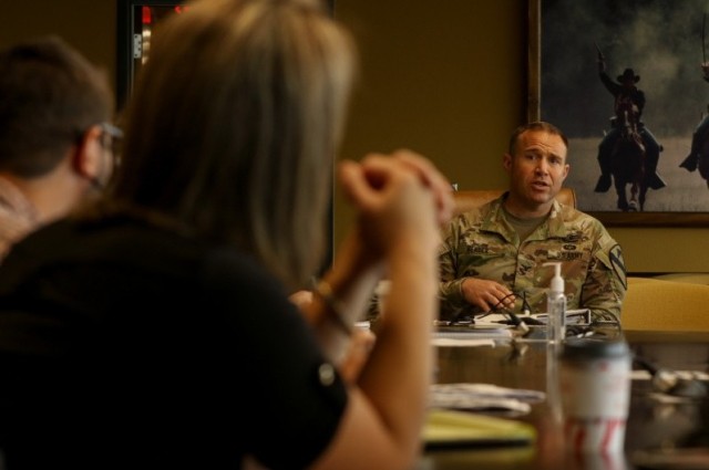 Col. Jonathan Bender, 1st Cavalry Division senior operations and planning officer, discusses collaboration concepts with Shannon Strank, deputy to U.S. Army Combat Capabilities Development Command Army Research Laboratory-South Open Campus during a round table discussion at the division&#39;s Headquarters at Fort Hood, Texas on May 12, 2021. The service recently implemented its Army Business Management Plan, which will improve business practices and processes. The plan is scheduled to undergo annual revisions until 2025. 