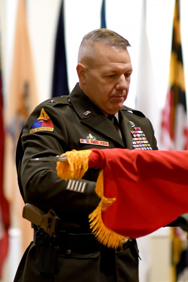 Brig. Gen. Charles Lombardo, Combined Arms Center-Training Deputy Commanding General unfurls his one-star flag during his promotion ceremony May 28, 2021 at the Frontier Conference Center, Fort Leavenworth, Kan. Photo by Tisha Swart-Entwistle, Combined Arms Center-Training.