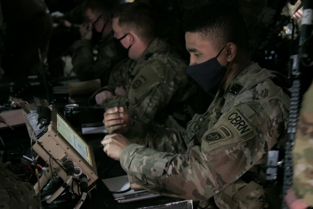 A U.S. Army Paratrooper assigned to 1st Brigade Combat Team, 82nd Airborne Division works inside of the tactical operations center during rotation 21-05 at the Joint Readiness Training Center on Fort Polk, La., March 8, 2021. The brigade was fielded with Capability Set 21 network equipment, which the Army is seeking to build upon with Capability Set 23 and Capability Set 25. (U.S. Army photo by Sgt. Justin Stafford)