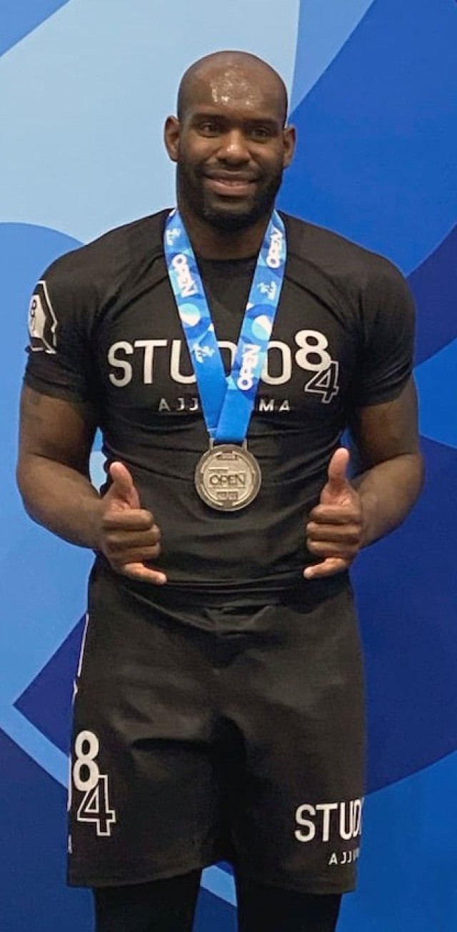 Staff Sgt. Dominick Williams of First Army’s 174th Infantry Brigade stands draped in the second-place medal he won in the Master 1 Ultra-Heavyweight black belt category at the International Brazilian Jiu-Jitsu Federation Open Championship in Houston.