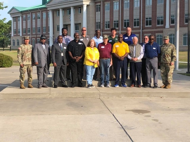 Community leaders pose for a group photo with Fort Stewart-Hunter Army Airfield leadership, May 26 on Fort Stewart prior to spending the day touring the installation. Col. Bryan Logan, Fort Stewart-Hunter Army Airfield Garrison Commander, invited over a dozen Mayors, City Managers and school administrators to visit Fort Stewart and Hunter Army Airfield to gain a better understanding of the Army mission and how the communities can better partner with the Army and support Army Families. (Photo by Chris Rich)