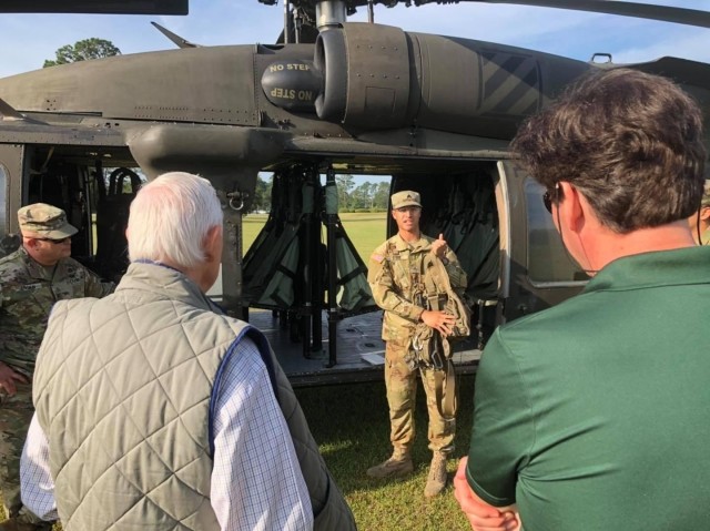 Sgt. Nikky Otero, 4th Battalion, 3rd Aviation Regiment, 3rd Combat Aviation Brigade, 3rd Infantry Division, gives a pre-flight briefing to local community leaders prior to flying to Hunter Army Airfield from Fort Stewart, May 26. Col. Bryan Logan, Fort Stewart-Hunter Army Airfield Garrison Commander, invited community leaders to visit the installation to gain a better understanding of the Army mission and how the communities can better partner with the Army and support Army Families.