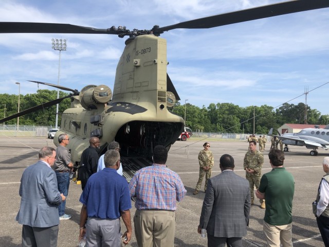 Coastal Georgia community leaders visit a CH-47 Chinook static display on Hunter Army Airfield as part of Community Leaders Day, May 26. Over a dozen mayors, city managers and school administrators were invited to visit Fort Stewart-Hunter Army Airfield to gain a better understanding of the Army mission and how the communities can better partner with the Army and support Army Families.