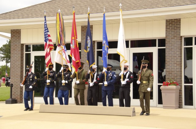 A joint-service color guard posts the colors as part of the Memorial Day ceremony Monday at the Missouri Veterans Cemetery - Fort Leonard Wood.