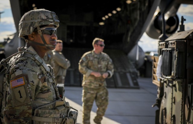 A U.S. Army Soldier assigned to Alpha Battery, 1st Battalion, 77th Field Artillery Regiment, 41st Field Artillery Brigade, monitors vehicle movement while vehicles are being loaded onto the C-17, belonging to the 1-64th Air Wing Tennessee Air National Guard, after Saber Guardian, at Novo Selo, Bulgaria, June 1, 2021. Saber Guardian 21 involves a rapid infiltration high mobility artillery rocket system live-fire conducted by 41st FAB as a sub-exercise of Defender 21, a 7th Army Training Command-led, U.S. Army Europe and Africa-directed exercise designed to increase readiness, lethality and interoperability by exercising allied and partner nations’ ability to integrate joint fires in a multinational environment at both the operation and tactical levels. (U.S. Army photo by Spc. Zack Stahlberg)