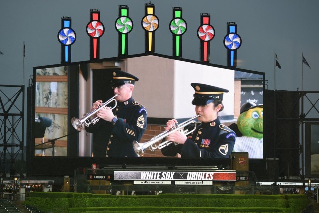Master Sgt. Ward Yager (left) and Staff Sgt. Tiffany Hoffer, with the United States Army Field Band Brass Quintet, perform in Chicago, May 28, 2021 for Memorial Day weekend at the Chicago White Sox home game versus the Baltimore Orioles. Saturday...