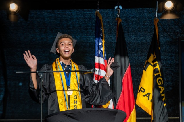 Stuttgart High School student council president, Kenneth Roedl, speaks to his fellow graduates during an outdoor, drive-in graduation ceremony at Panzer Barracks, Germany, June 2, 2021.