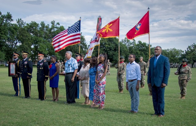 Brig. Gen. Richard Harrison (third from left) stands as part of the official party for his promotion ceremony June 2, 2021, at Fort Sill, Oklahoma. Harrison is the commandant of the Air Defense Artillery School, chief of ADA, and the deputy...