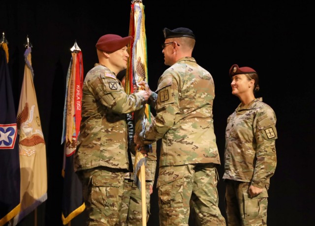 Lt. Col. Daniel T. Trost receives the unit colors from Col. Jason P. Affolder during a June 4 change of command ceremony at Fort lee, Va. Trost, who will take command of the 262nd Quartermaster Battalion, replaced Lt. Col. Heather M. Reilly who will be heading off to the 82nd Airborne Division G/4 for a year,  and then transition to the Senior Service College.