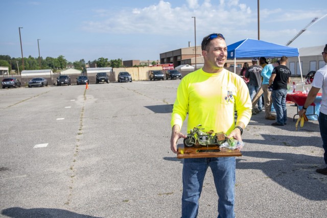 Motorcycle mentors of 165th Infantry Brigade gave Col. Eric Flesch a goodbye gift during the Memorial Day Ride event, May 28.