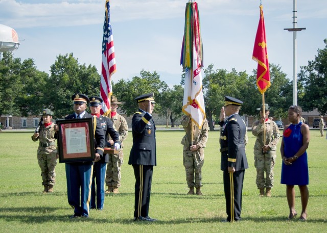 Maj. Gen. Sean Gainey, left, leads Brig. Gen. Richard Harrison in the Oath of Office at Harrison’s promotion ceremony June 2, 2021, at Fort Sill, Oklahoma.