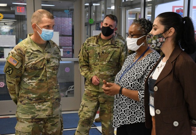 Sgt. Maj. of the Army Michael Grinston talks with Robin Banks, Child and Youth Services chief, and Laura Manganaro, Chapel Drive Child Development Center facility director, during his visit to Fort Drum on June 3. (Photo by Mike Strasser, Fort...