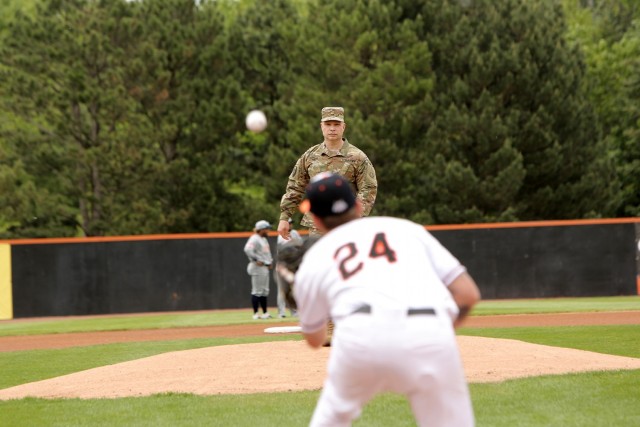 Maj. Scott Hager, Headquarters and Headquarters Company commander for the 85th U.S. Army Reserve Support Command, throws out the ceremonial first pitch during the Schaumburg Boomers Memorial Day home game vs. the Gateway Grizzlies, May 31, 2021,...