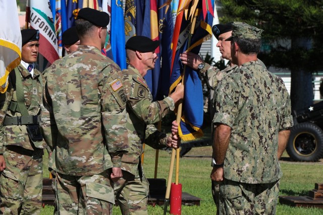 U.S. Army Command Sgt. Maj. Scott A. Brzak, right, the U.S. Army Pacific command sergeant major, passes the unit's colors to Gen. Paul J. LaCamera, outgoing USARPAC commander during the change of command ceremony June 4, 2021 at Fort Shafter, Hawaii. The ceremony was hosted by U.S. Navy Adm. John C. Aquilino, U.S. Indo-Pacific commander. (U.S. Army photo by Staff Sgt. Jennifer A. Delaney)