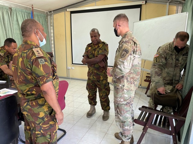 Lt. Col. Jeremiah O'Connor receives a briefing from a contingent of military leaders from the Papua New Guinea Defense Force regarding the capabilities of a forward supply battalion at Murray Barracks, Papua New Guinea, May 24, 2021.  The U.S. Army Soldiers partnering with Papua New Guinea are assigned to the 6th Battalion, 5th Security Force Assistance Brigade, and will be training with the PNGDF for approximately a month.