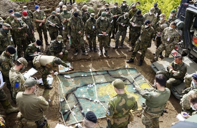 2nd Battalion, 8th Cavalry Regiment, 1st Armored Brigade Combat Team alongside NATO allies and European partnered countries brief Lt. Col. Sebastian Hebisch, commander of Enhanced Forward Presence Battle Group, Lithuania on joint operations and...