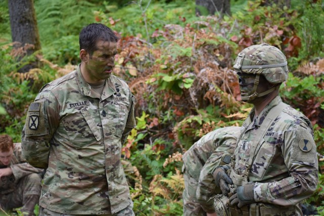 Command Sgt. Major Stephen Helton of 7th Infantry Division discusses an upcoming mission with 1st Sgt. Justin Estelle of Charger Company, 1st Battalion, 5th Infantry Regiment, 1st Stryker Brigade Combat Team, 25th Infantry Division during Courage Ready 18-02 at Joint Base Lewis McChord, August 3. Challenging and critical training events like EDREs strengthen unit cohesion at all levels, and improves America's First Corps tactical proficiency.